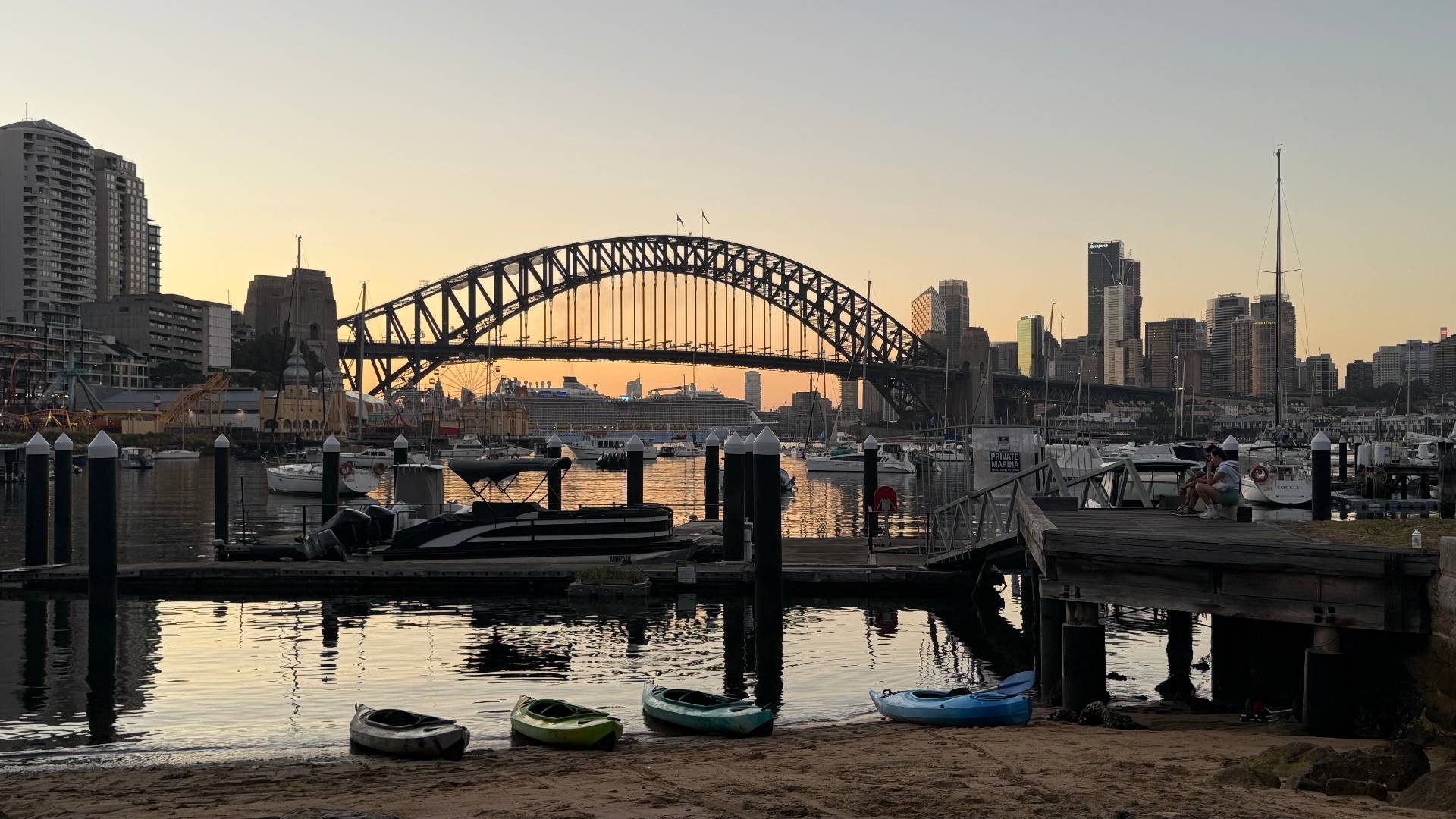Kayaks at Lavender Bay dock during Sydney Harbour sunset
