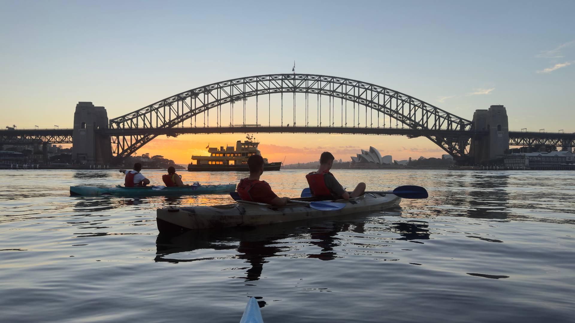 Sydney Kayak Tours group with ferry and Harbour Bridge